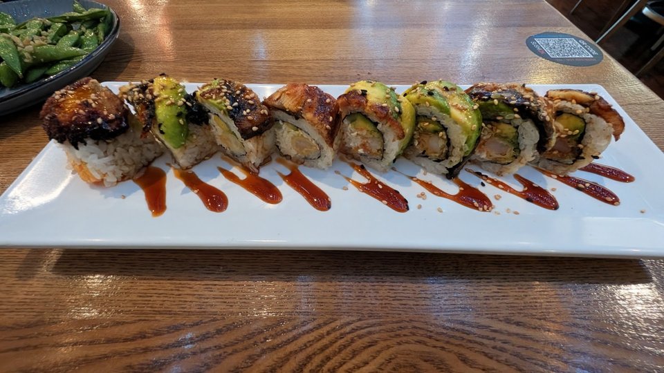 Plates of Japanese entrees in a strip mall eatery.